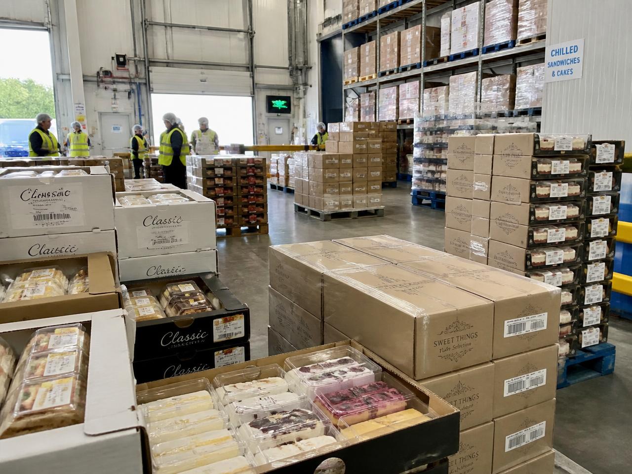 Chilled warehouse at GAGG FOODS LTD stocked with boxed sandwiches and cakes